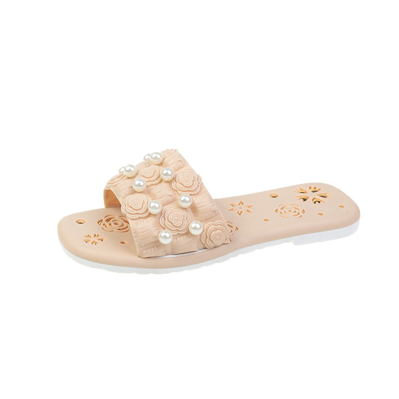 Płaskie jednokolorowe sandały z perłowymi kwiatami