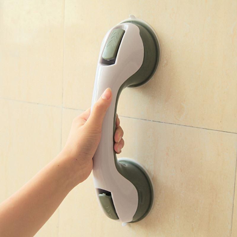 Bathroom handrail with suction cup handle